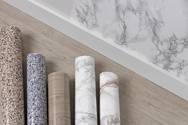 Professional removing wallpaper from interior wall